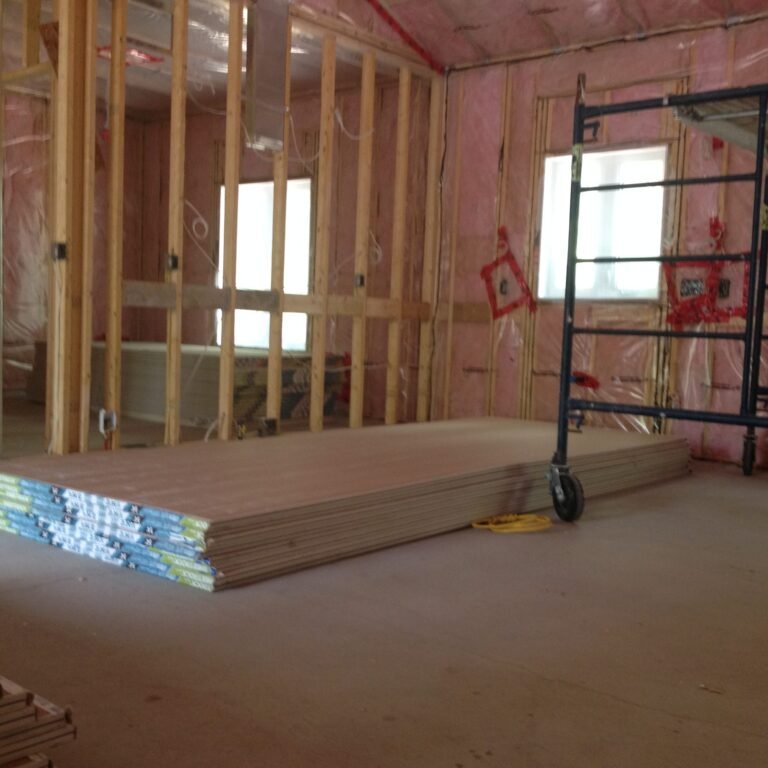 Framed addition with pink batts and poly vapour barrier before drywall