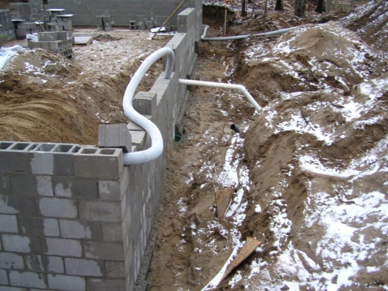 Concrete block foundation with weeping tile before backfill