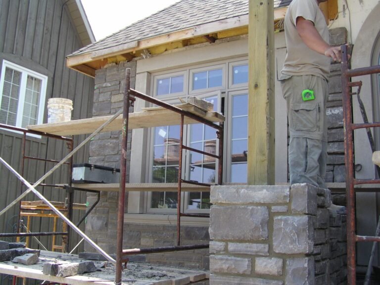 Masons On Scaffold Stone Front - Ontario house by the builder