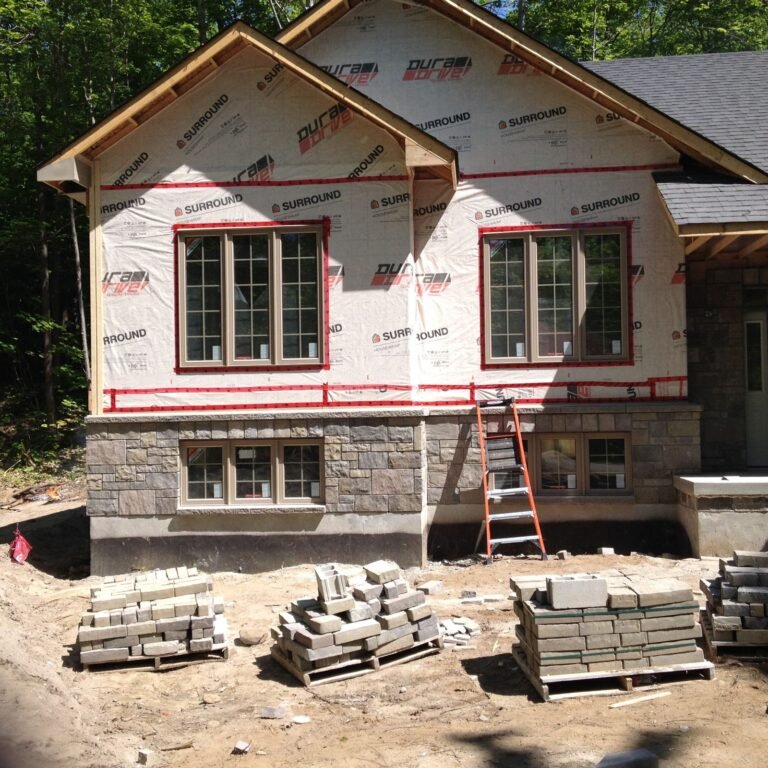 Stone Front House Wrap Ladders - Ontario house by the builder